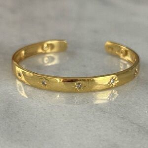 Gold Crystal Star Burst Engraved Bangle Bracelet 

Brand New